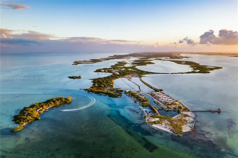 an aerial view of a house with a ocean view
