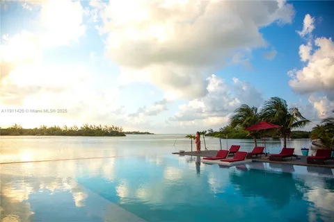 a front view of building with yard