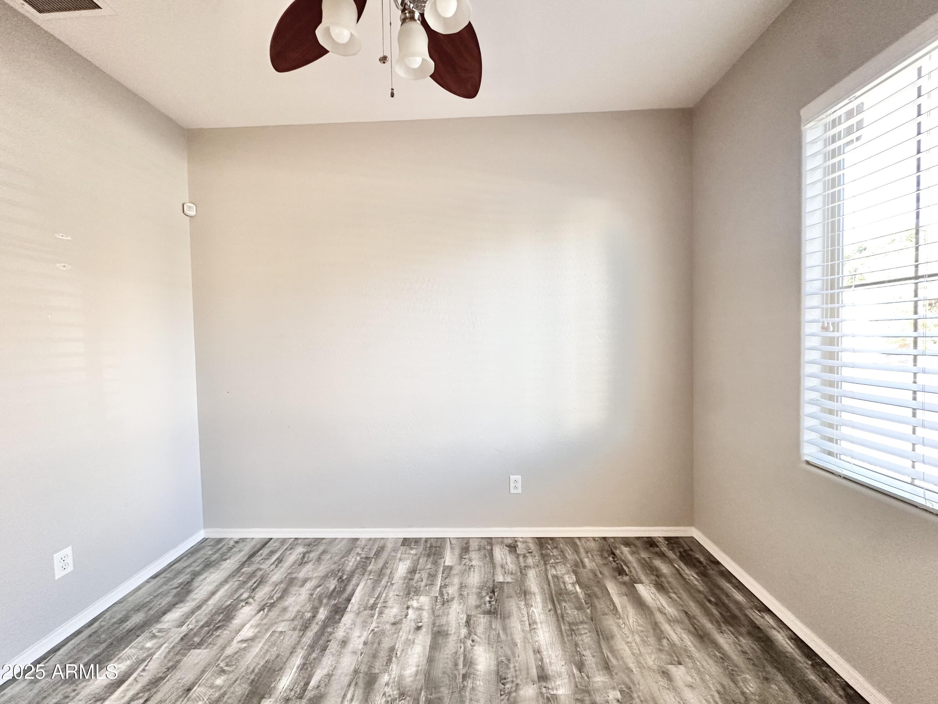 16511 West Tether Trail Surprise, AZ 85387 - Photo 9 of 88 an empty room with a window