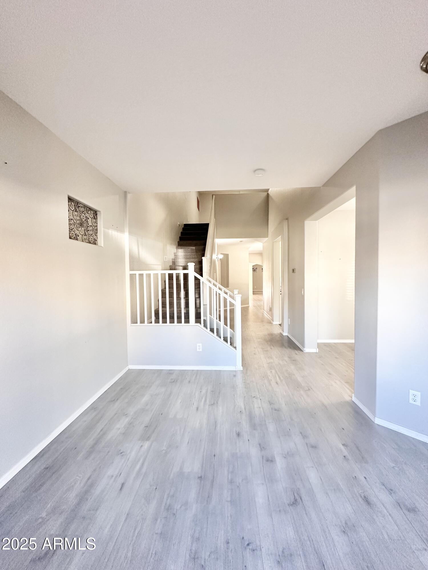 16511 West Tether Trail Surprise, AZ 85387 - Photo 14 of 88 a view of livingroom with furniture and wooden floor