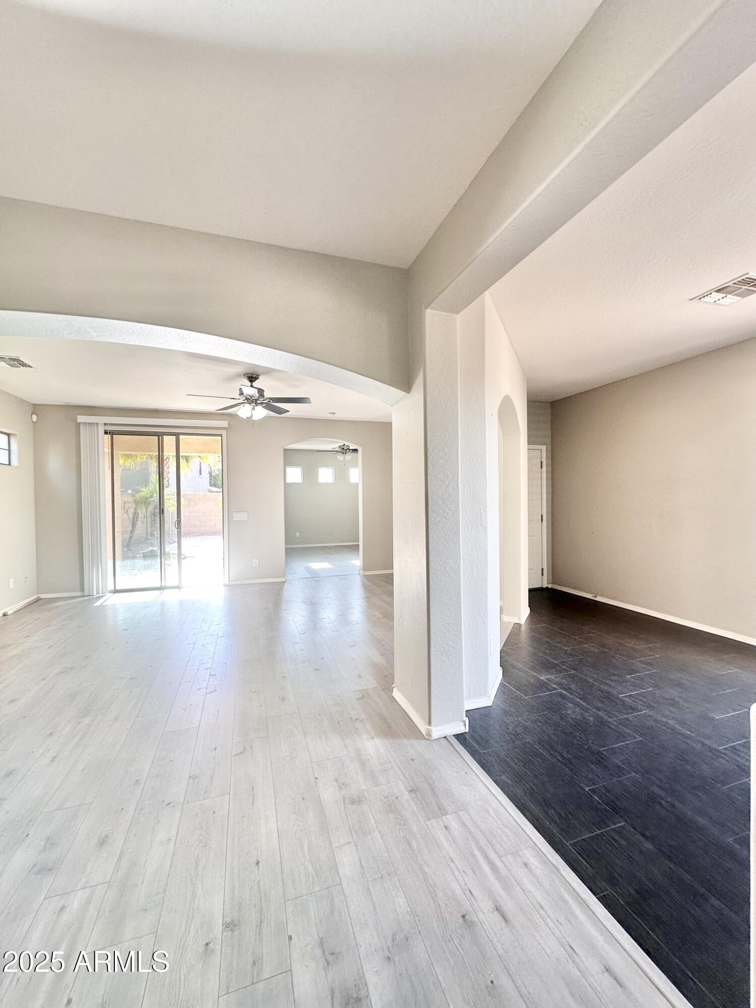 16511 West Tether Trail Surprise, AZ 85387 - Photo 28 of 88 wooden floor in an empty room with a window