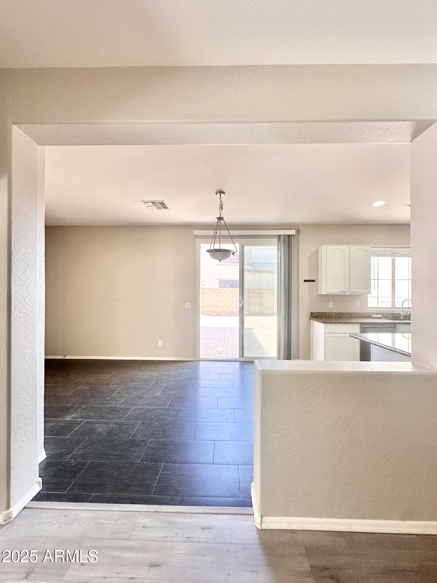 16511 West Tether Trail Surprise, AZ 85387 - Photo 29 of 88 a living room with stainless steel appliances wooden floor and large window