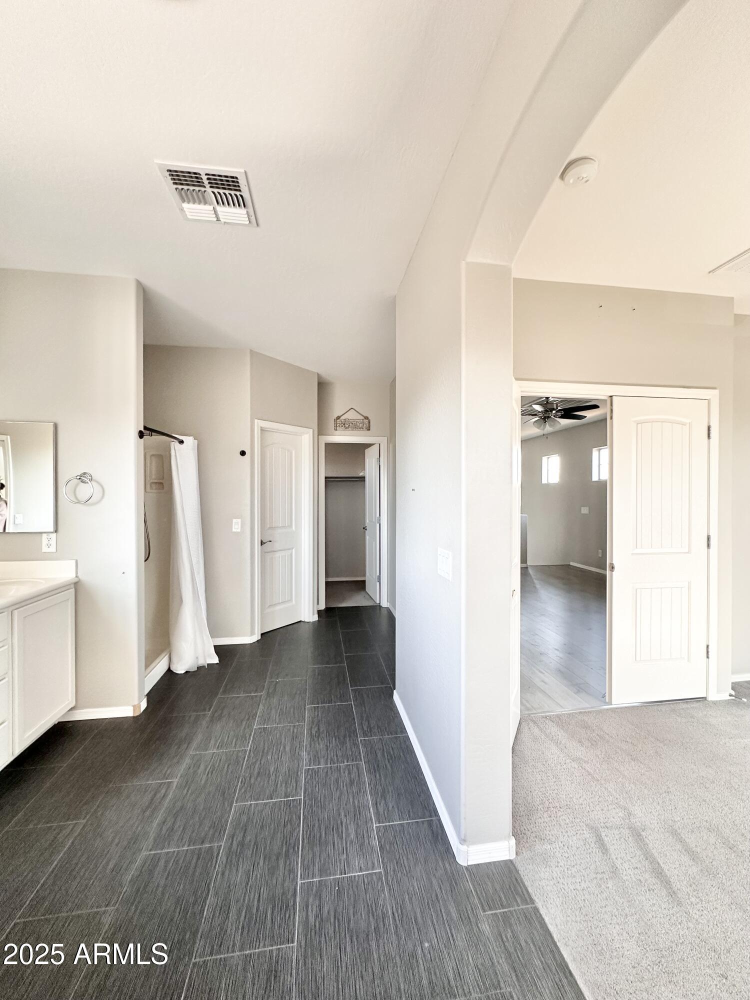 16511 West Tether Trail Surprise, AZ 85387 - Photo 48 of 88 a view of a hallway with wooden floor and closet