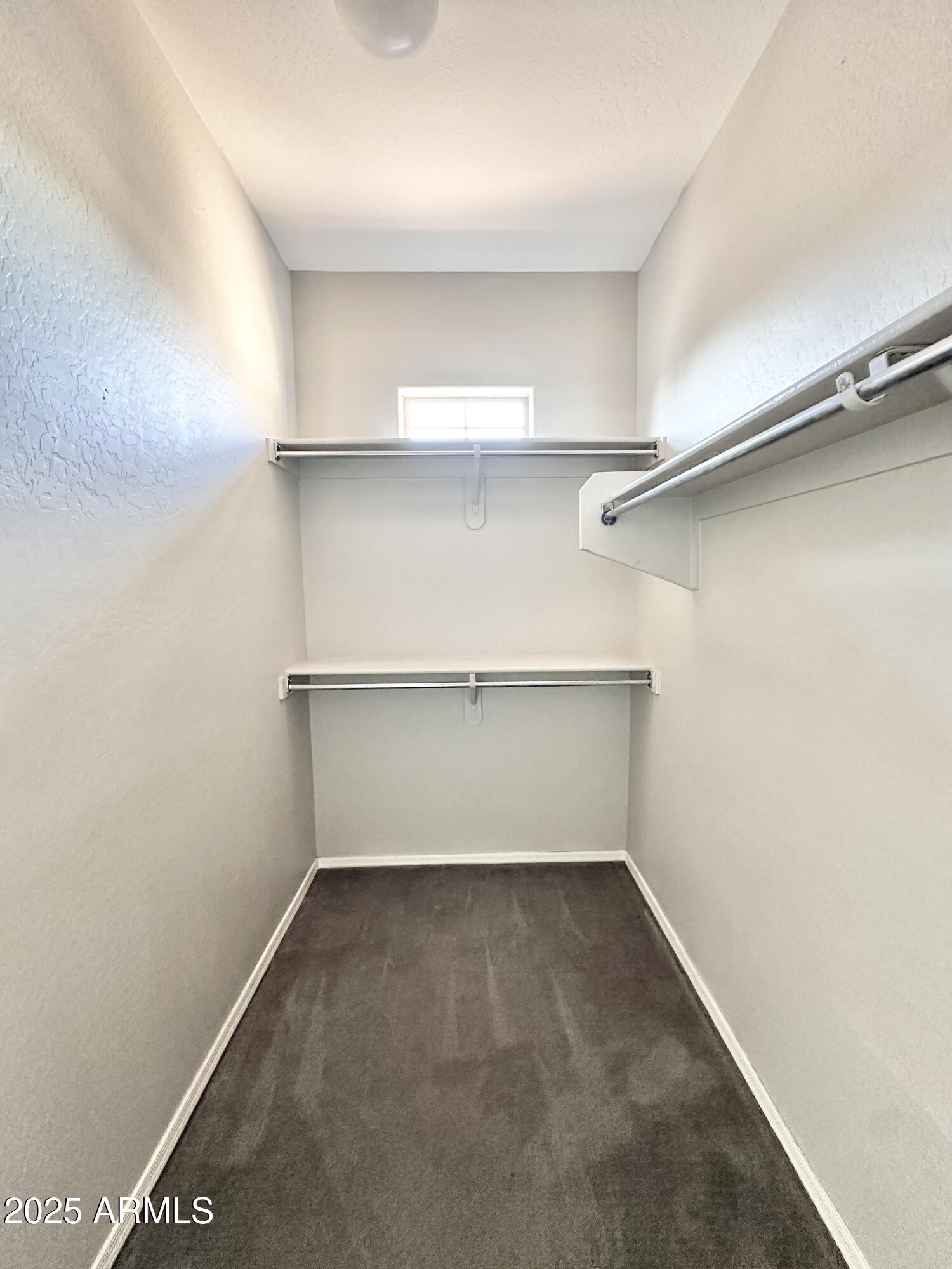 16511 West Tether Trail Surprise, AZ 85387 - Photo 52 of 88 a view of a room with shelf