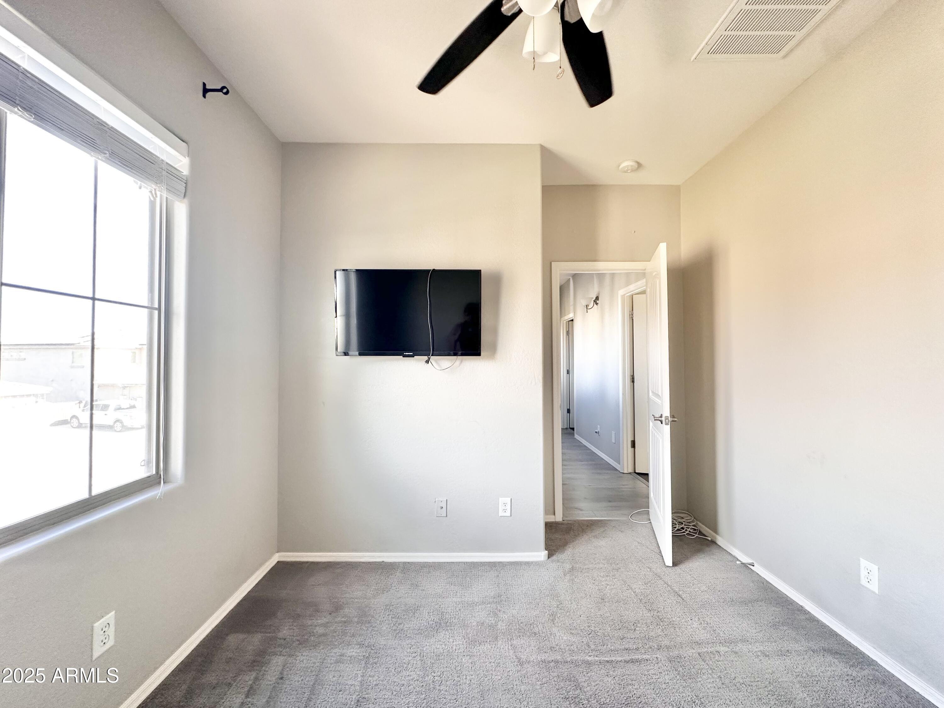 16511 West Tether Trail Surprise, AZ 85387 - Photo 58 of 88 a view of an empty room with a bathroom and a window
