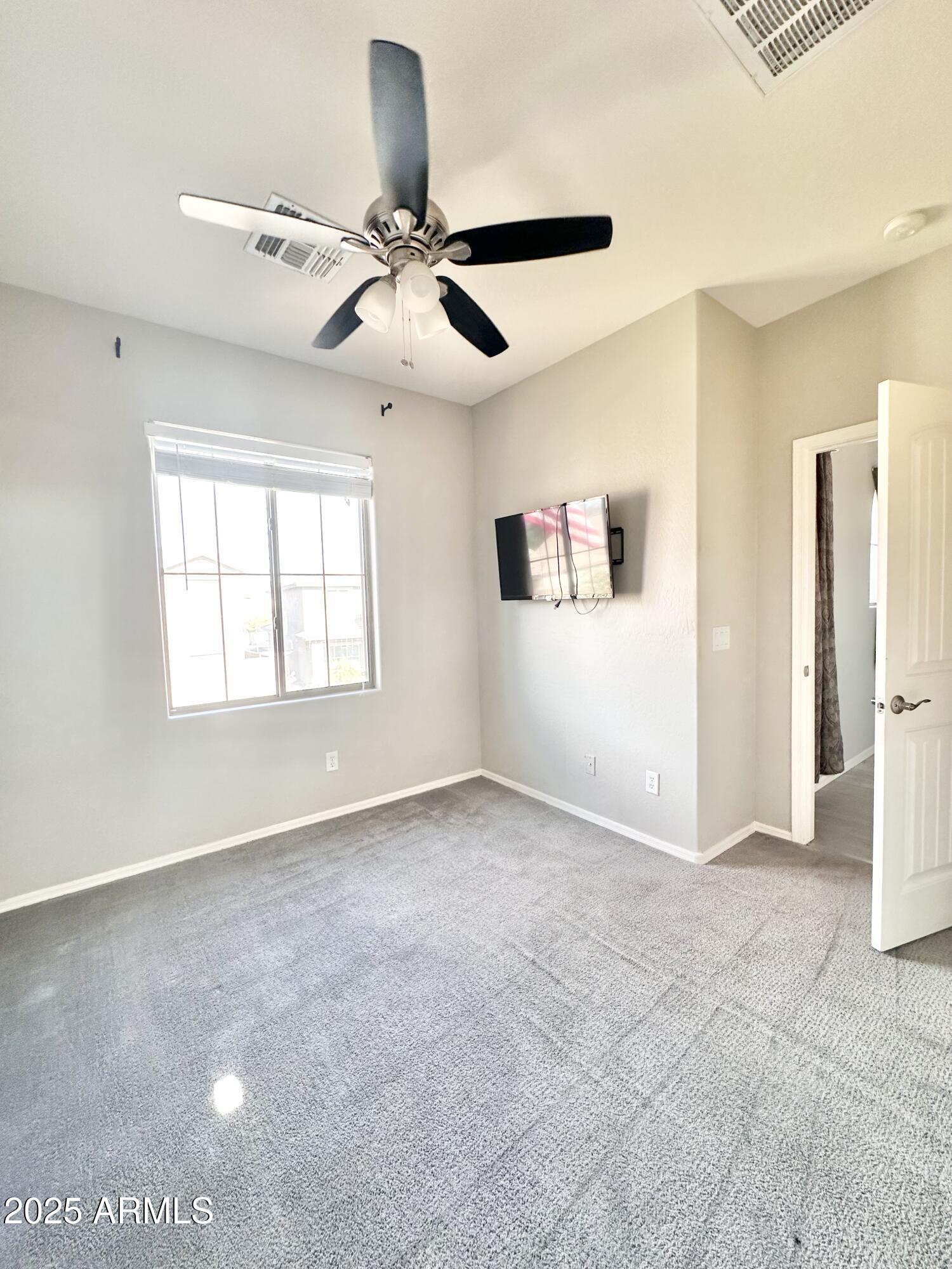 16511 West Tether Trail Surprise, AZ 85387 - Photo 59 of 88 a view of an empty room with a window