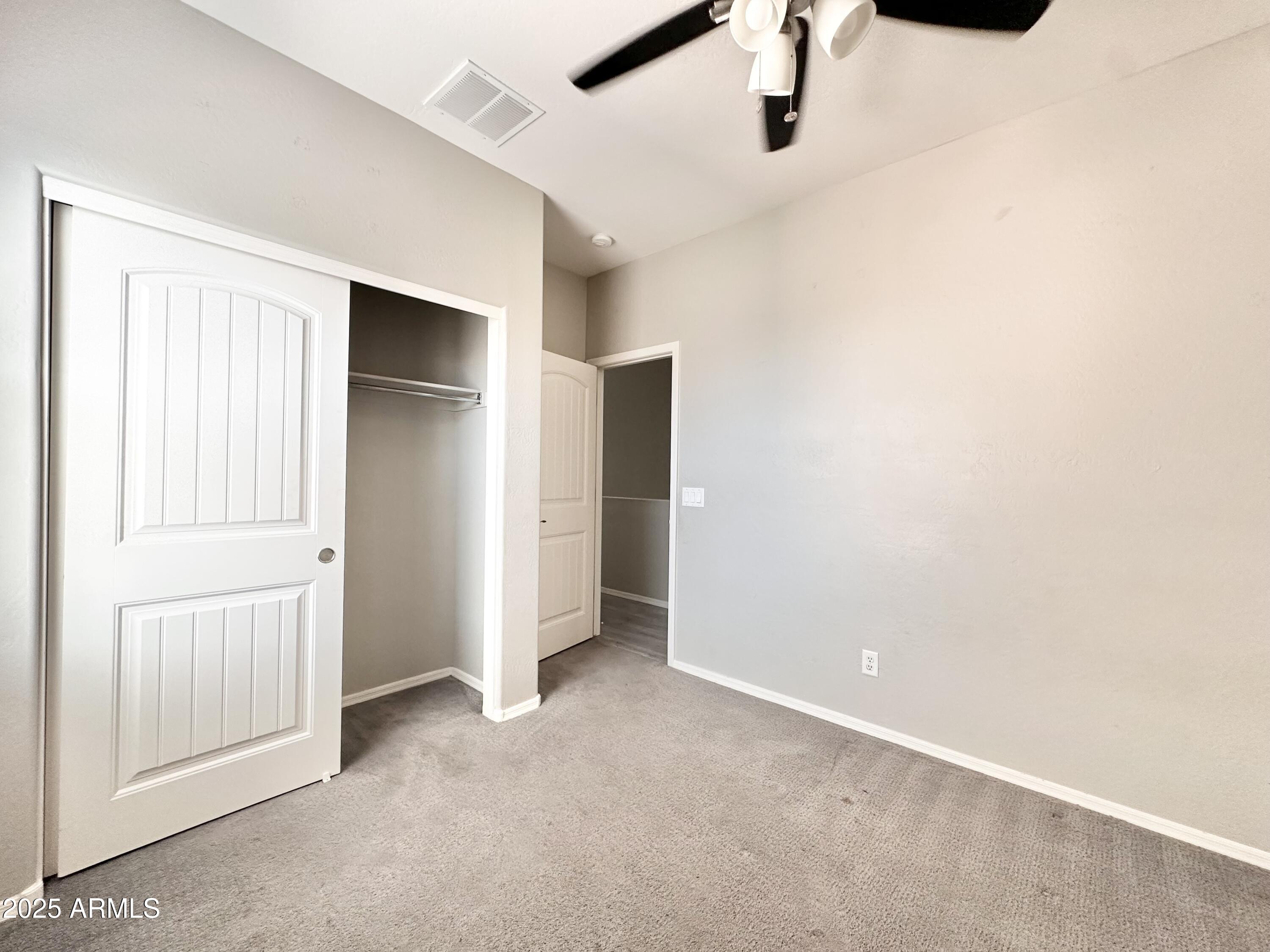 16511 West Tether Trail Surprise, AZ 85387 - Photo 66 of 88 an empty room with windows