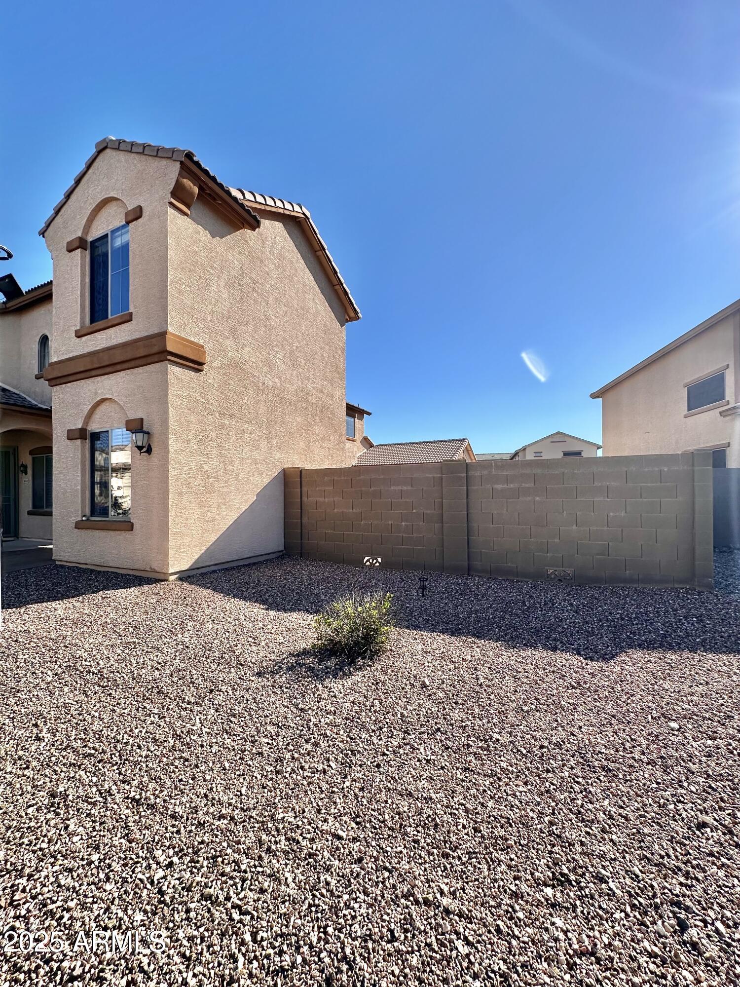 16511 West Tether Trail Surprise, AZ 85387 - Photo 71 of 88 a front view of a house with a yard