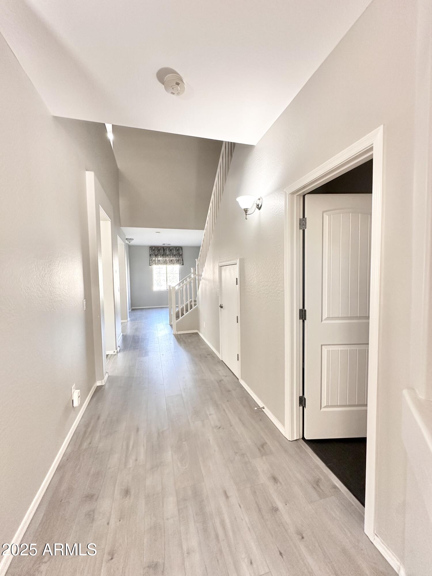 16511 West Tether Trail Surprise, AZ 85387 - Photo 85 of 88 a view of a hallway with wooden floor