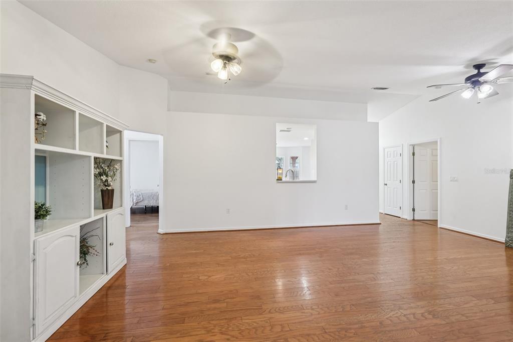 12315 Fort King Road Dade City, FL 33525 - Photo 15 of 77 wooden floor in an empty room with a window