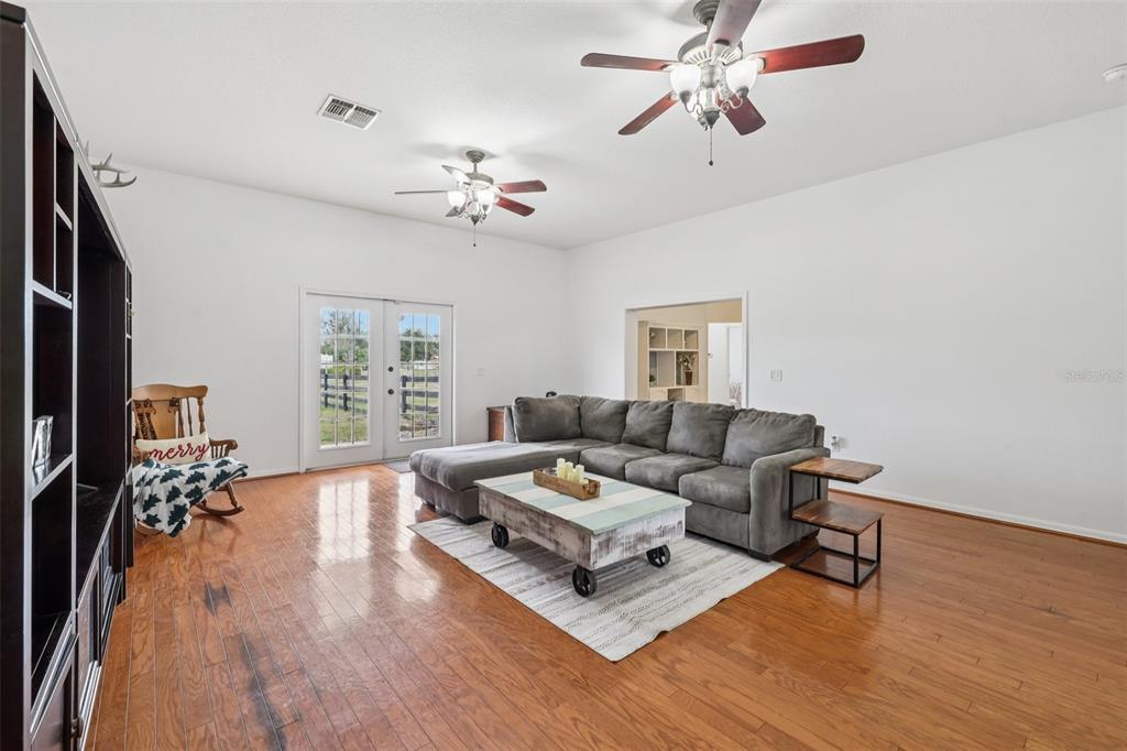 12315 Fort King Road Dade City, FL 33525 - Photo 17 of 77 a living room with furniture and a chandelier
