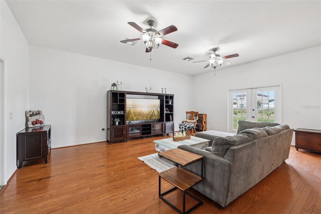 12315 Fort King Road Dade City, FL 33525 - Photo 20 of 77 a living room with furniture and a flat screen tv