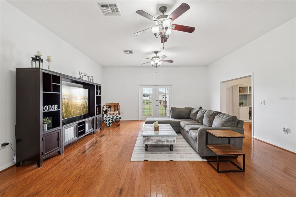 12315 Fort King Road Dade City, FL 33525 - Photo 21 of 77 a living room with furniture and a flat screen tv