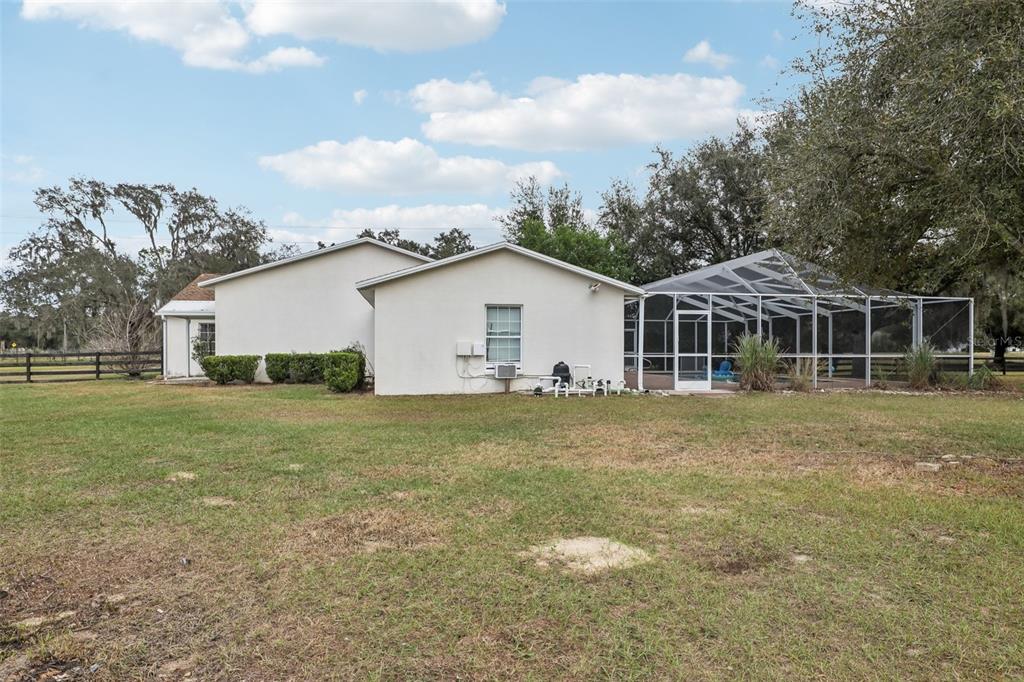 12315 Fort King Road Dade City, FL 33525 - Photo 54 of 77 a view of a house with a backyard