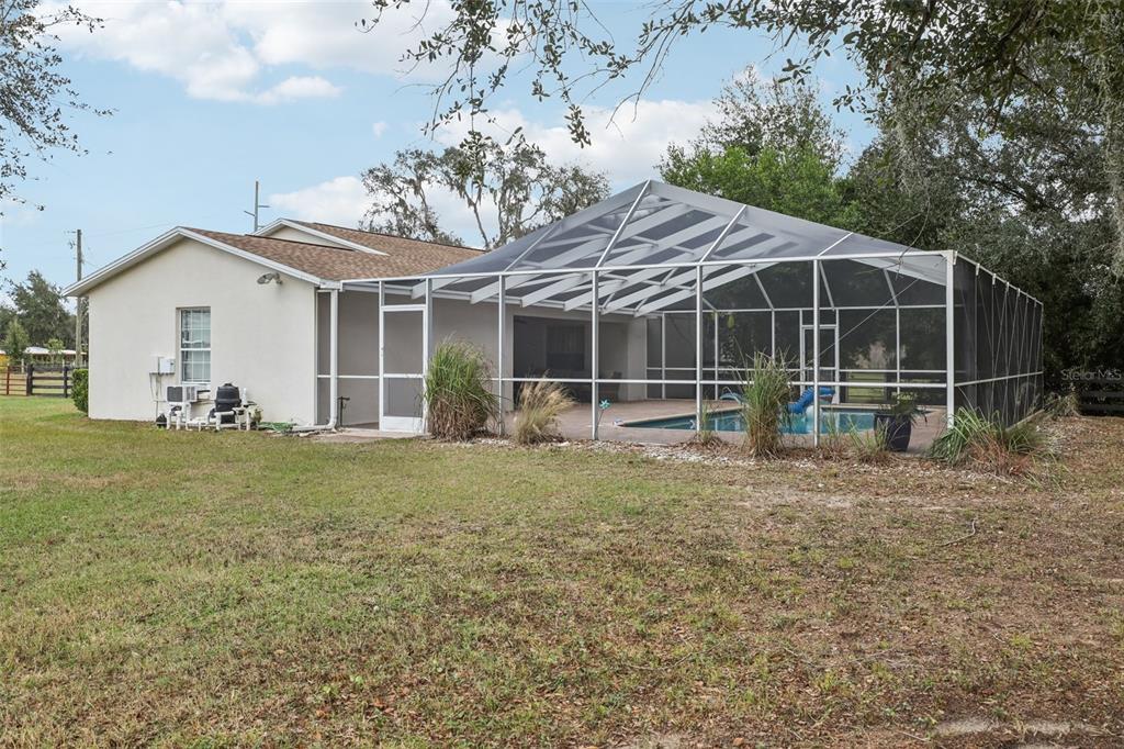12315 Fort King Road Dade City, FL 33525 - Photo 55 of 77 a view of a house with backyard