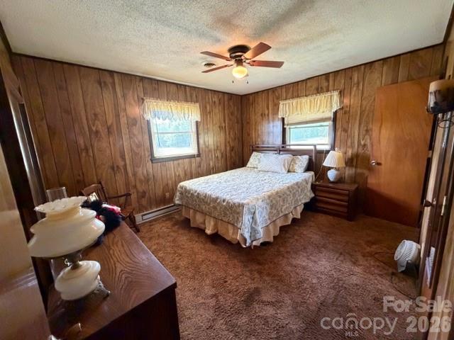 20415 Efird Road Albemarle, NC 28001 - Photo 10 of 16 a bedroom with a bed and a chandelier