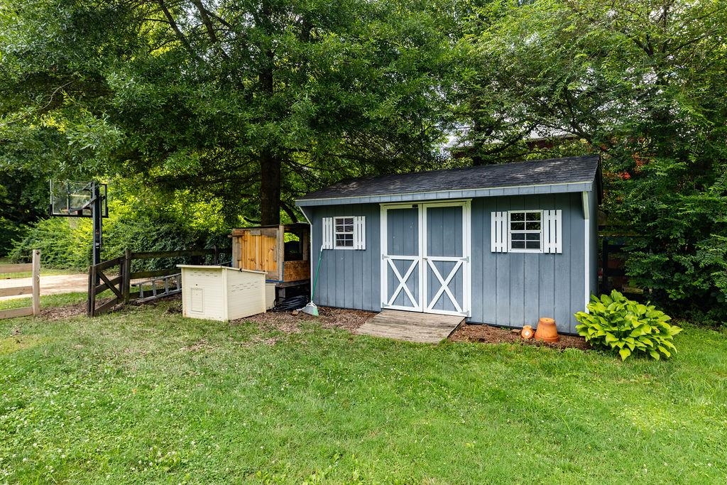 7549 Thomas Spring Road Bridgewater, VA 22812 - Photo 14 of 57 a view of a house with backyard sitting area and garden