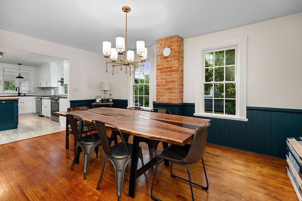 7549 Thomas Spring Road Bridgewater, VA 22812 - Photo 30 of 57 a dining room filled chandelier and wooden floor