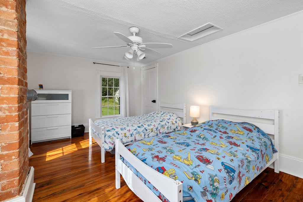 7549 Thomas Spring Road Bridgewater, VA 22812 - Photo 46 of 57 a bedroom with a bed and wooden floor