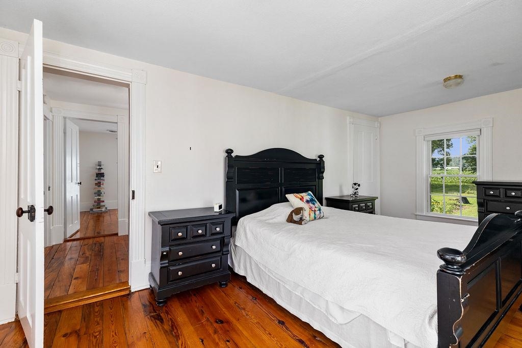 7549 Thomas Spring Road Bridgewater, VA 22812 - Photo 50 of 57 a bedroom with a bed and wooden floor