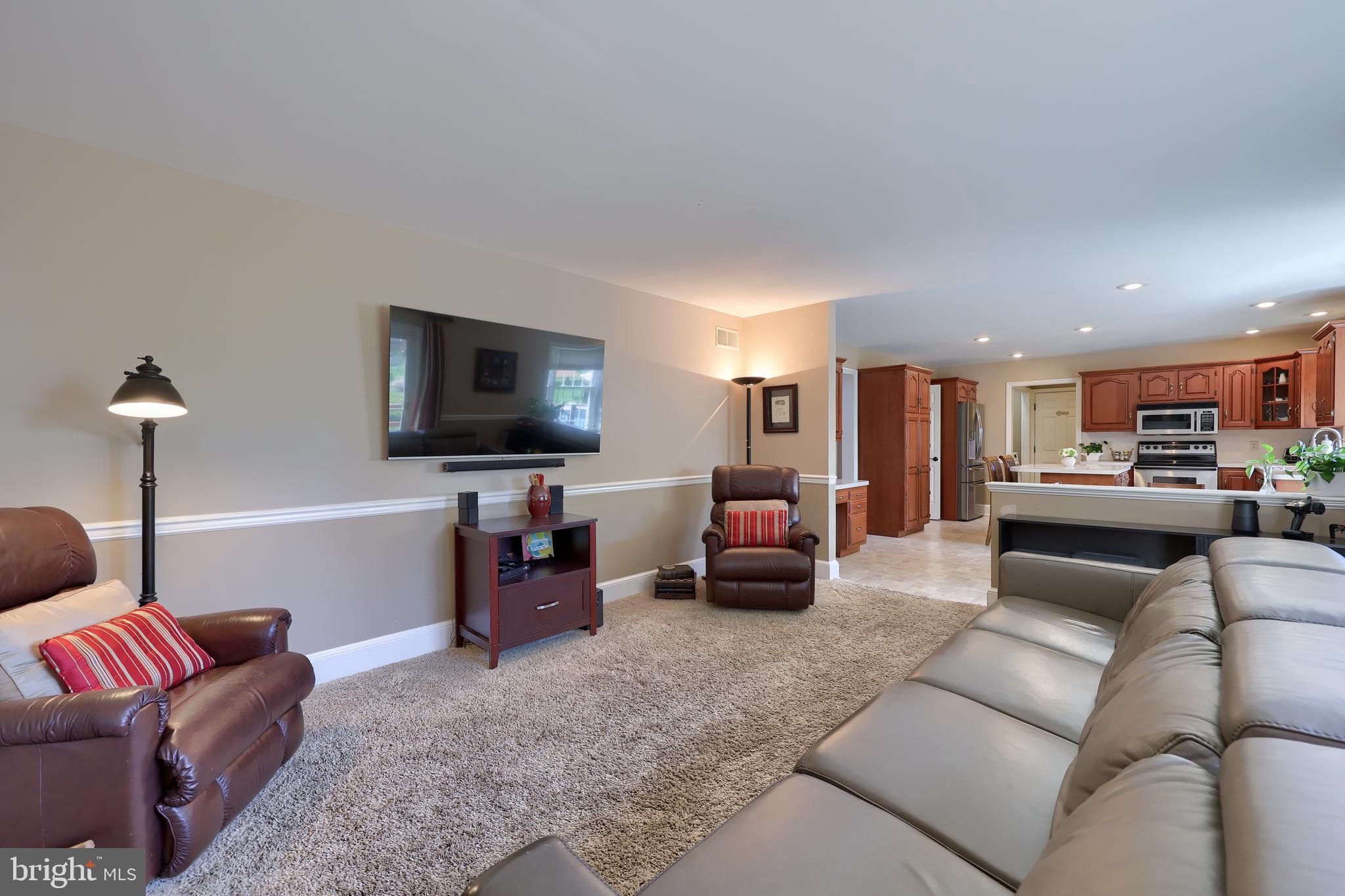 105 Hammersmith Lane Lititz, PA 17543 - Photo 12 of 49 a living room with furniture and a flat screen tv