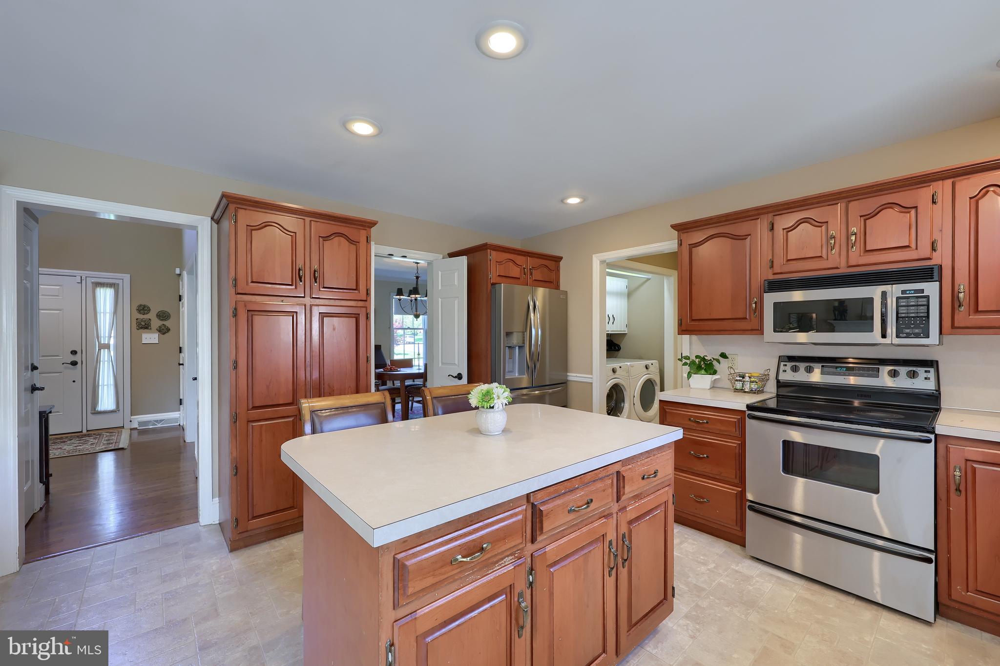 105 Hammersmith Lane Lititz, PA 17543 - Photo 20 of 49 a kitchen with stainless steel appliances a stove a refrigerator and a sink