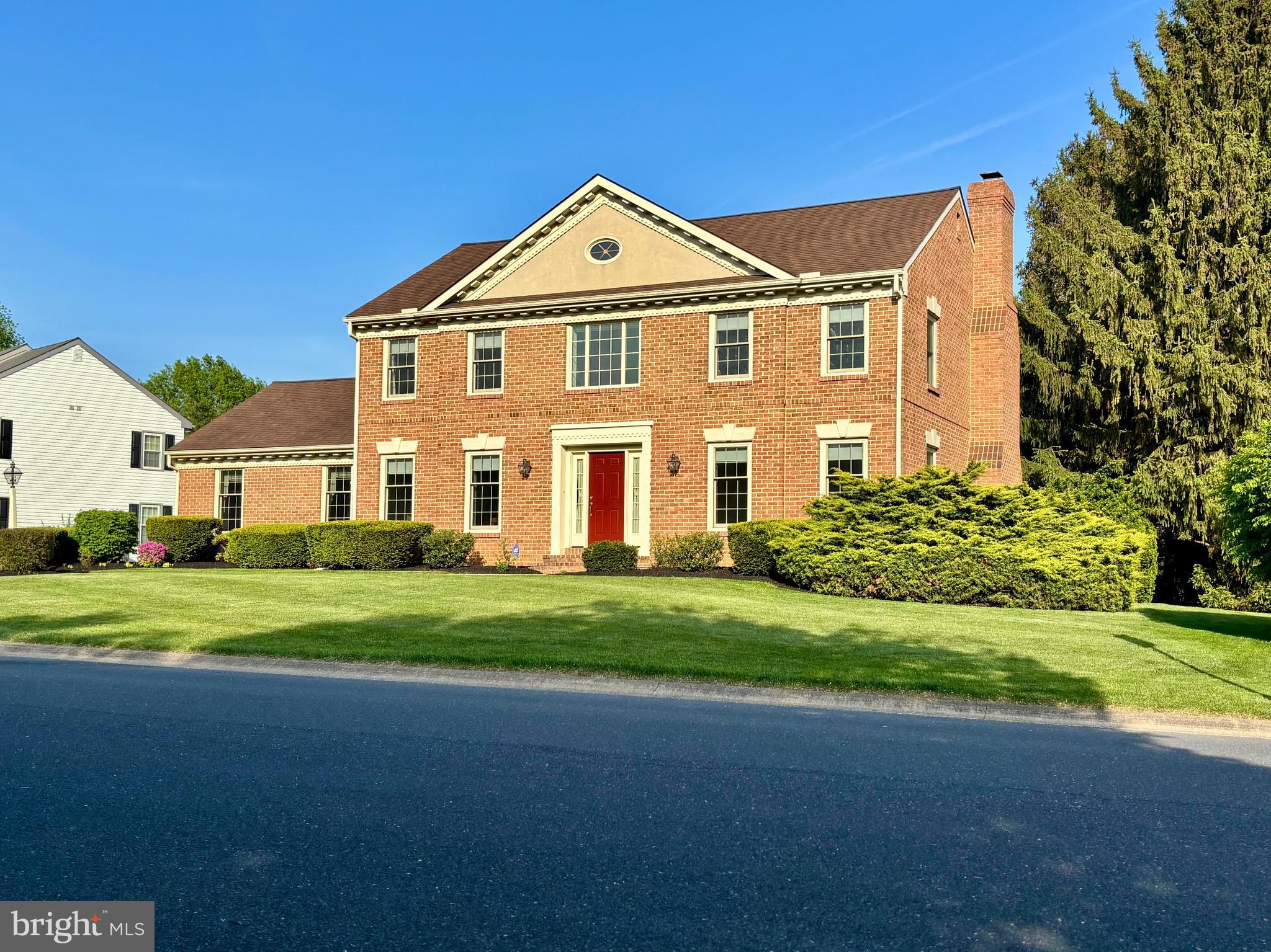105 Hammersmith Lane Lititz, PA 17543 - Photo 2 of 49 a front view of a house with a yard and garage