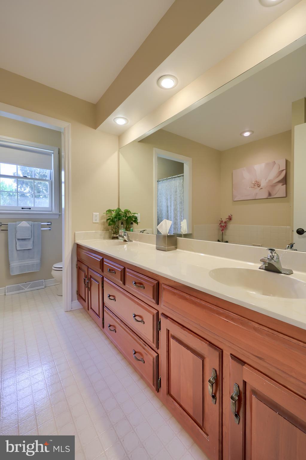 105 Hammersmith Lane Lititz, PA 17543 - Photo 28 of 49 a spacious bathroom with double vanity and a large mirror