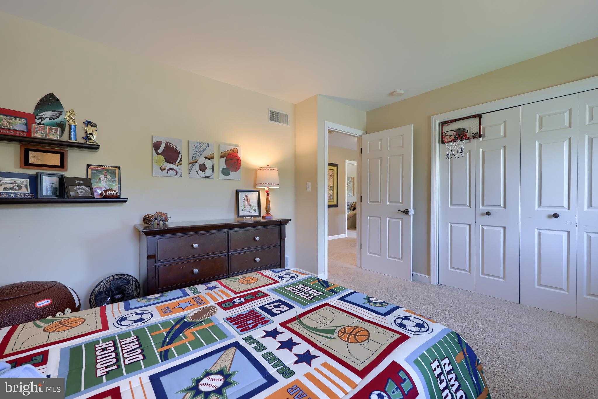 105 Hammersmith Lane Lititz, PA 17543 - Photo 31 of 49 a bed room with a bed and a book shelf