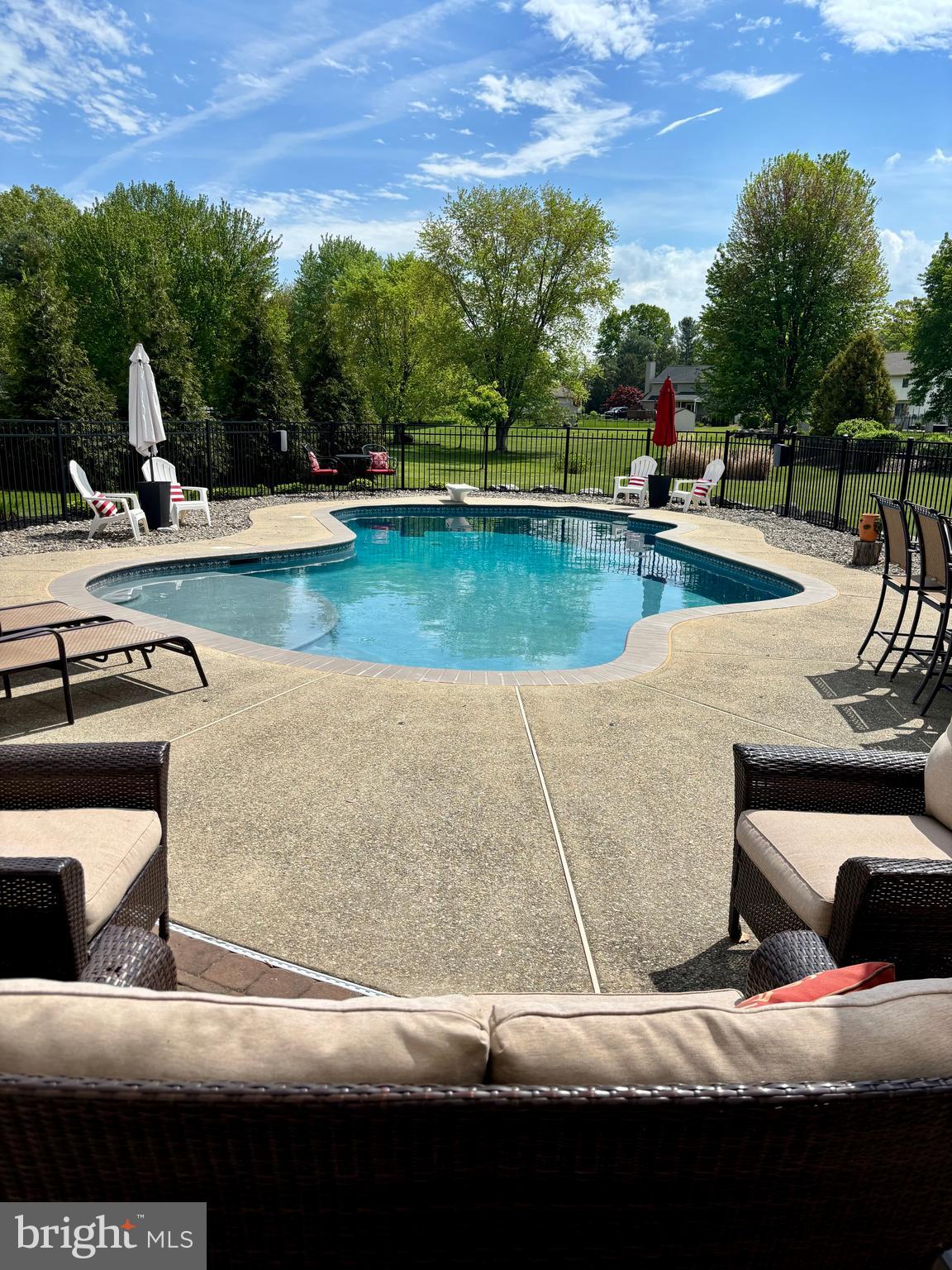 105 Hammersmith Lane Lititz, PA 17543 - Photo 37 of 49 a view of swimming pool with lawn chairs and plants