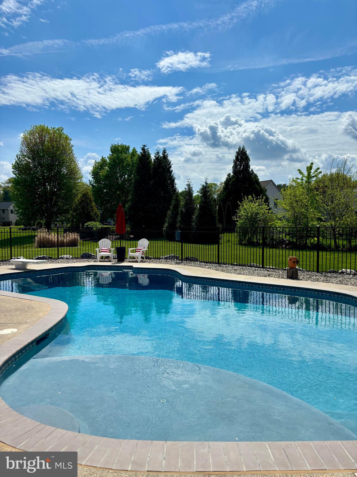 105 Hammersmith Lane Lititz, PA 17543 - Photo 40 of 49 a view of a swimming pool with a garden and trees