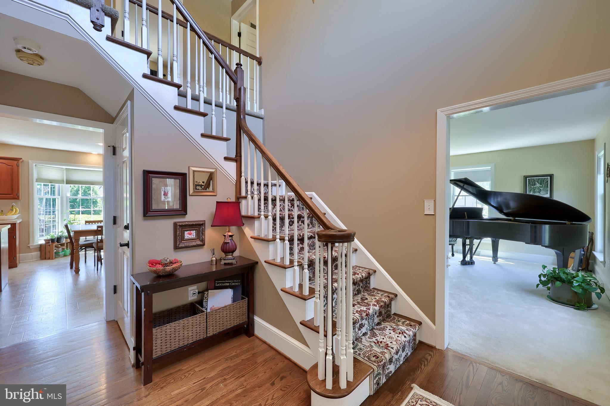 105 Hammersmith Lane Lititz, PA 17543 - Photo 4 of 49 a view of entryway dining room and hall with wooden floor