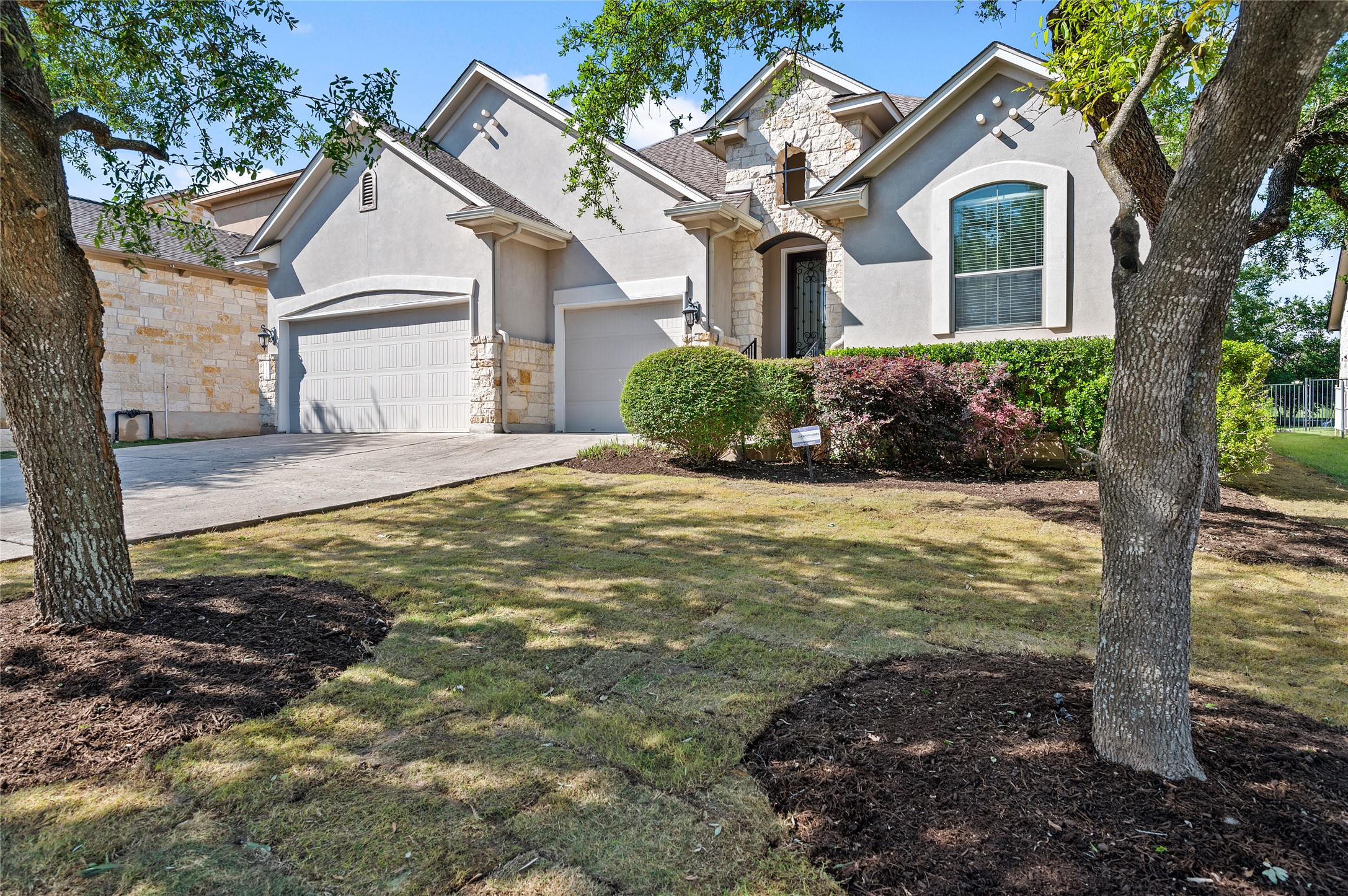 a front view of a house with garden