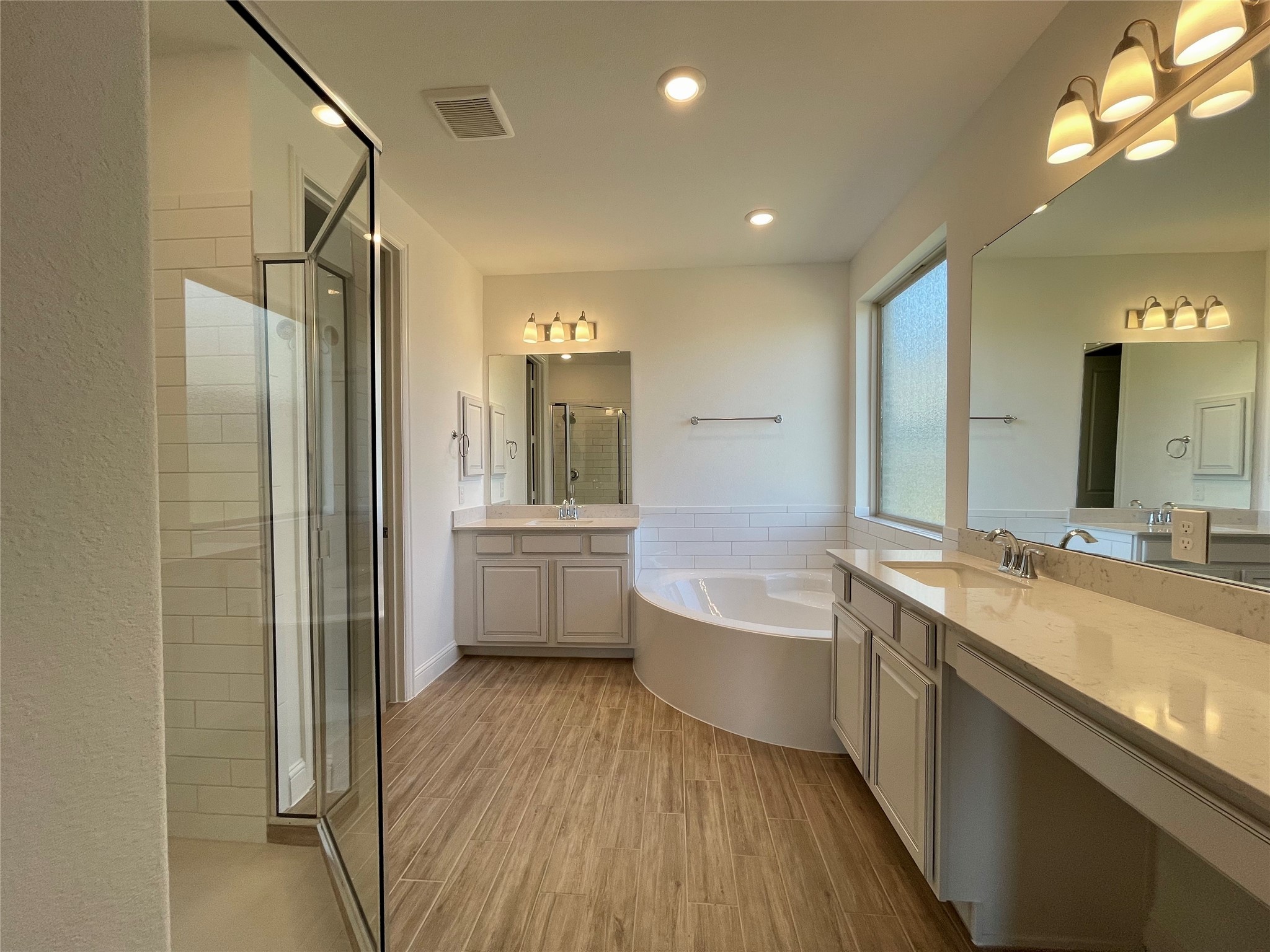 29806 Cherry Vine Road Katy, TX 77494 - Photo 5 of 30 a bathroom with a tub a sink and mirror
