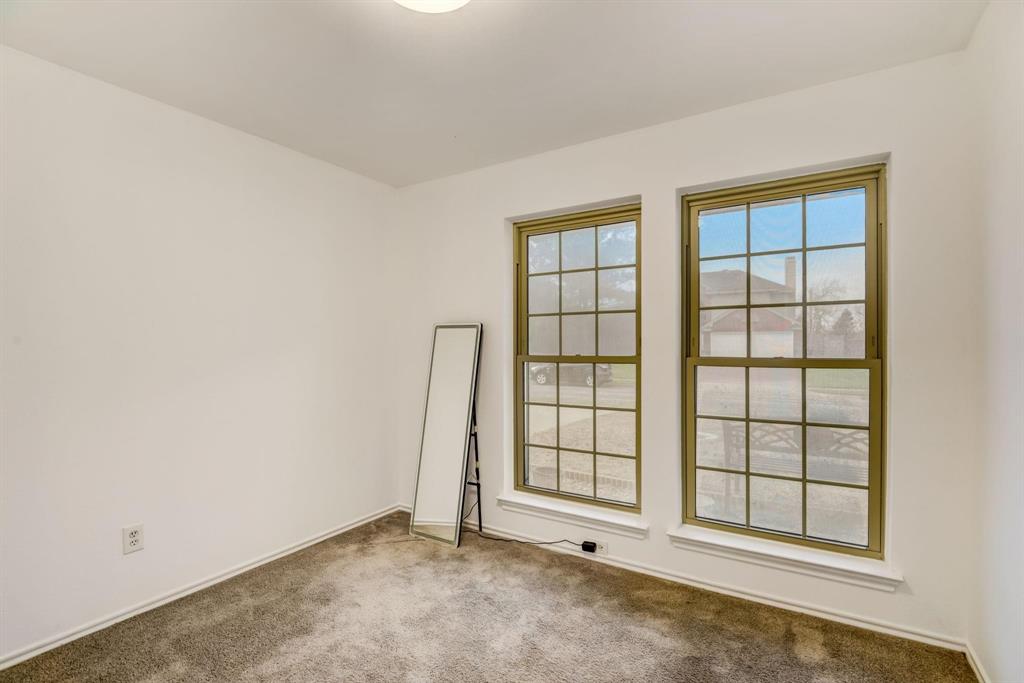 4233 Glen Ridge Drive Arlington, TX 76016 - Photo 30 of 34 an empty room with windows
