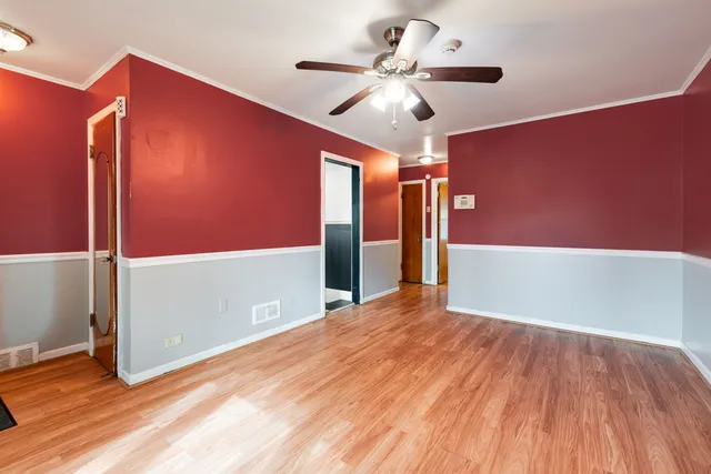 a view of livingroom with hardwood floor and a ceiling fan