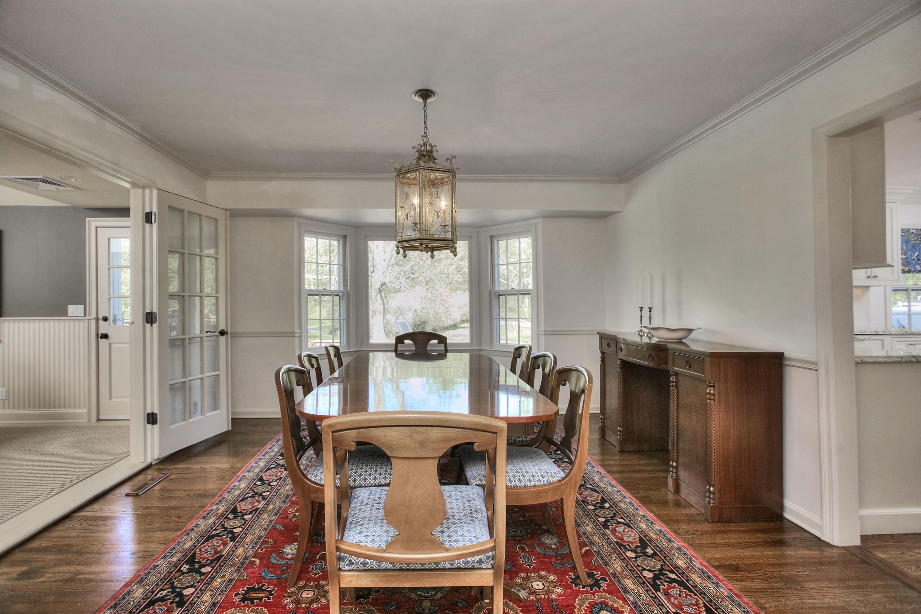195 Ponus Ridge Road New Canaan, CT 06840 - Photo 11 of 28 a view of a dining room with furniture window and wooden floor