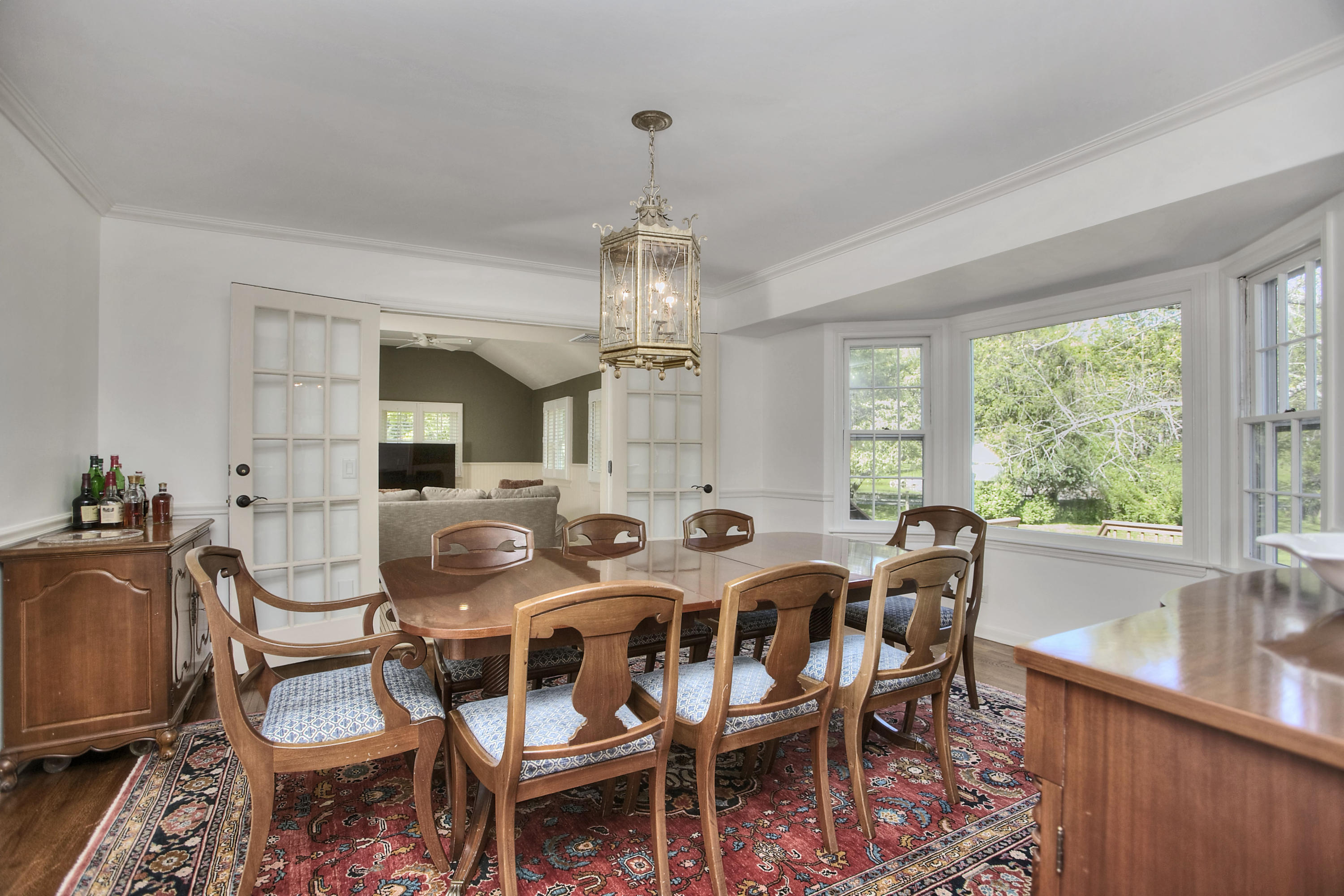 195 Ponus Ridge Road New Canaan, CT 06840 - Photo 12 of 28 a view of a dining room with furniture window and outside view