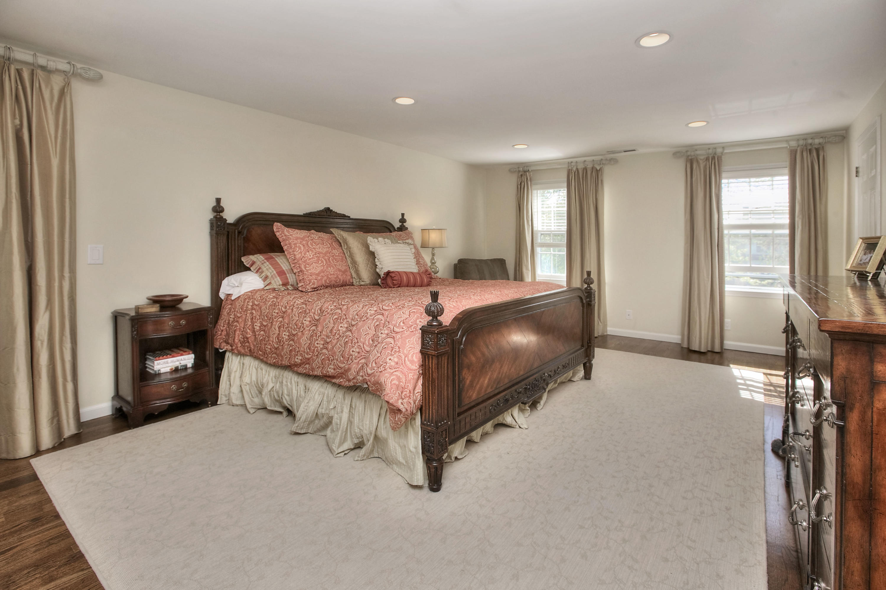 195 Ponus Ridge Road New Canaan, CT 06840 - Photo 13 of 28 a bedroom with bed and large windows