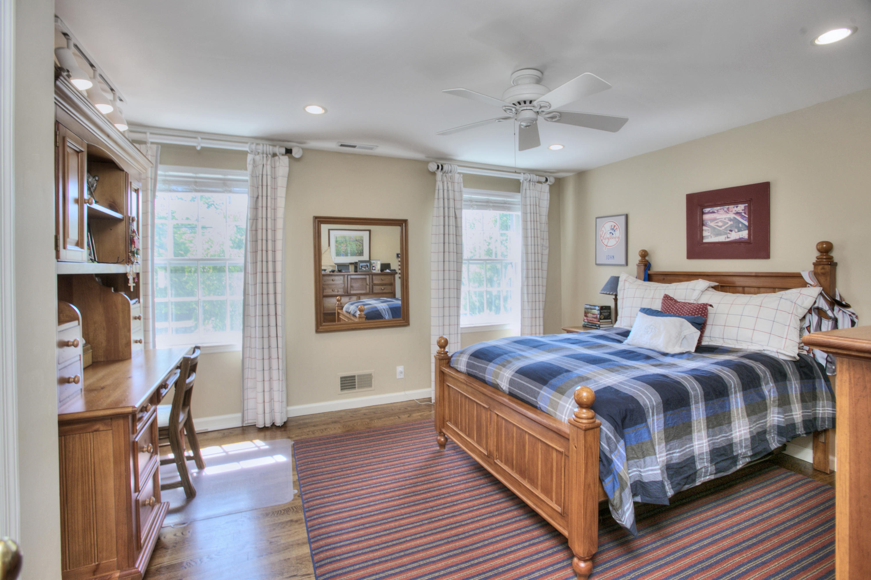 195 Ponus Ridge Road New Canaan, CT 06840 - Photo 16 of 28 a bed room with a bed and a chandelier