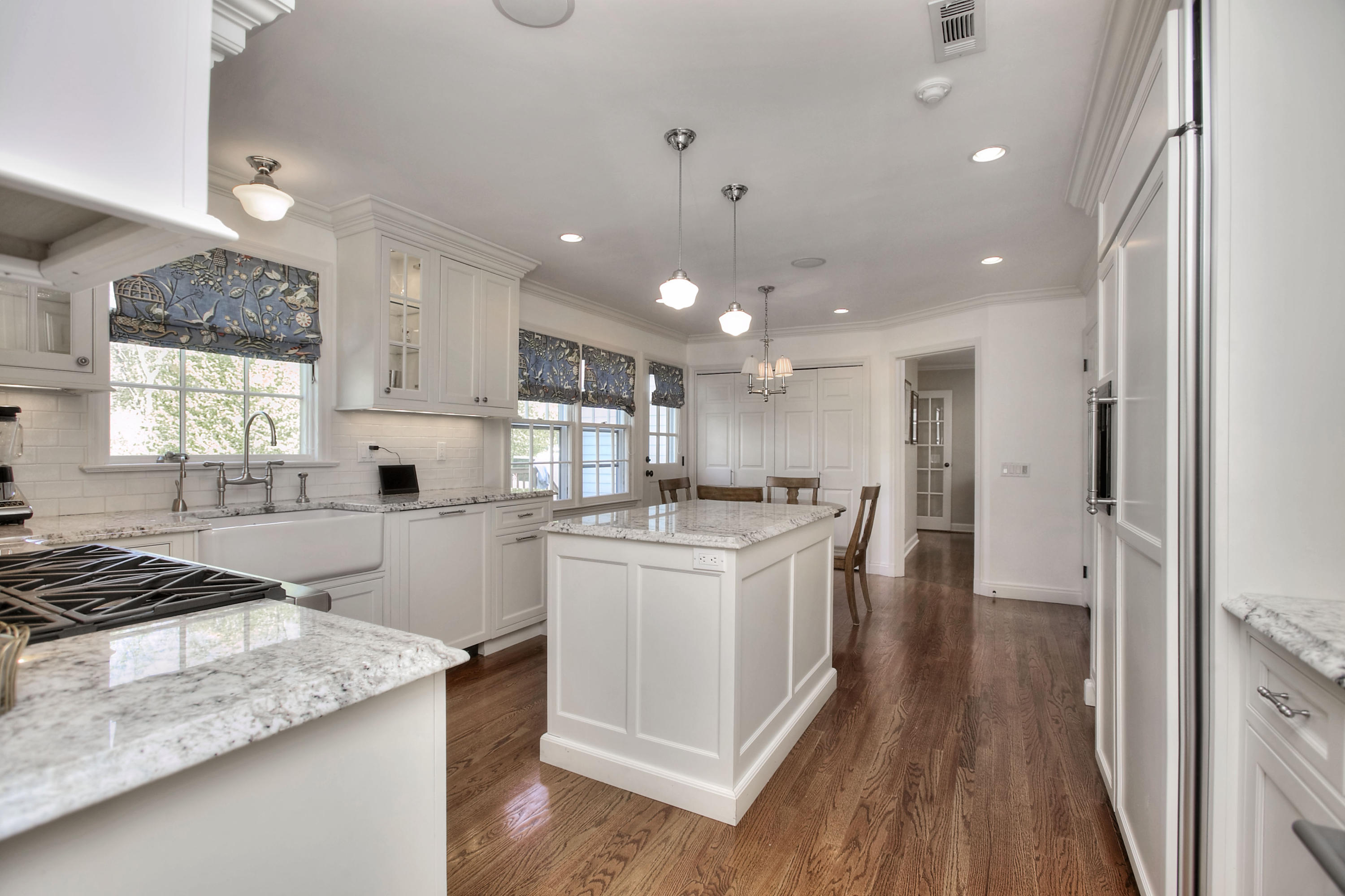 195 Ponus Ridge Road New Canaan, CT 06840 - Photo 4 of 28 a kitchen with stainless steel appliances kitchen island granite countertop a stove a sink and a refrigerator