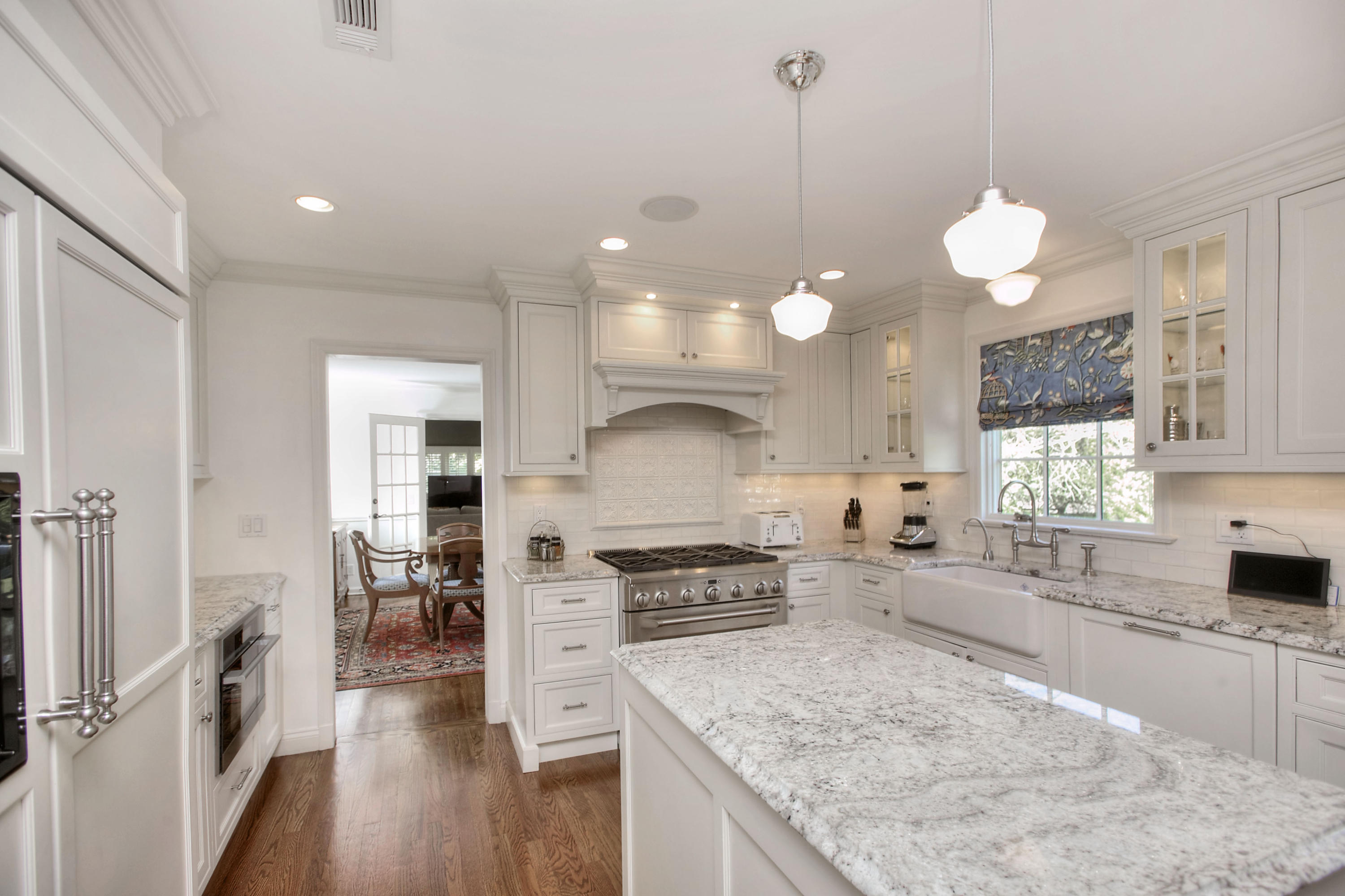 195 Ponus Ridge Road New Canaan, CT 06840 - Photo 5 of 28 a kitchen with stainless steel appliances granite countertop a sink stove and refrigerator