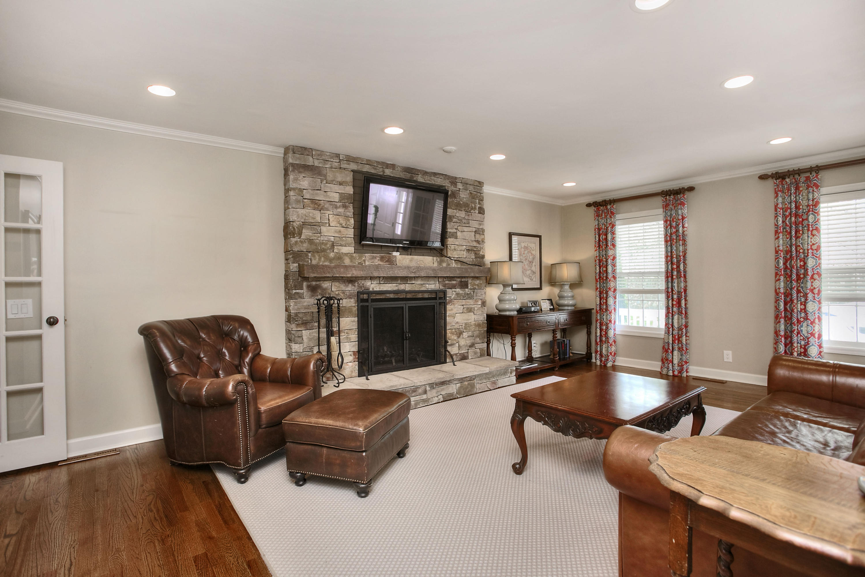 195 Ponus Ridge Road New Canaan, CT 06840 - Photo 7 of 28 a living room with furniture fireplace and flat screen tv