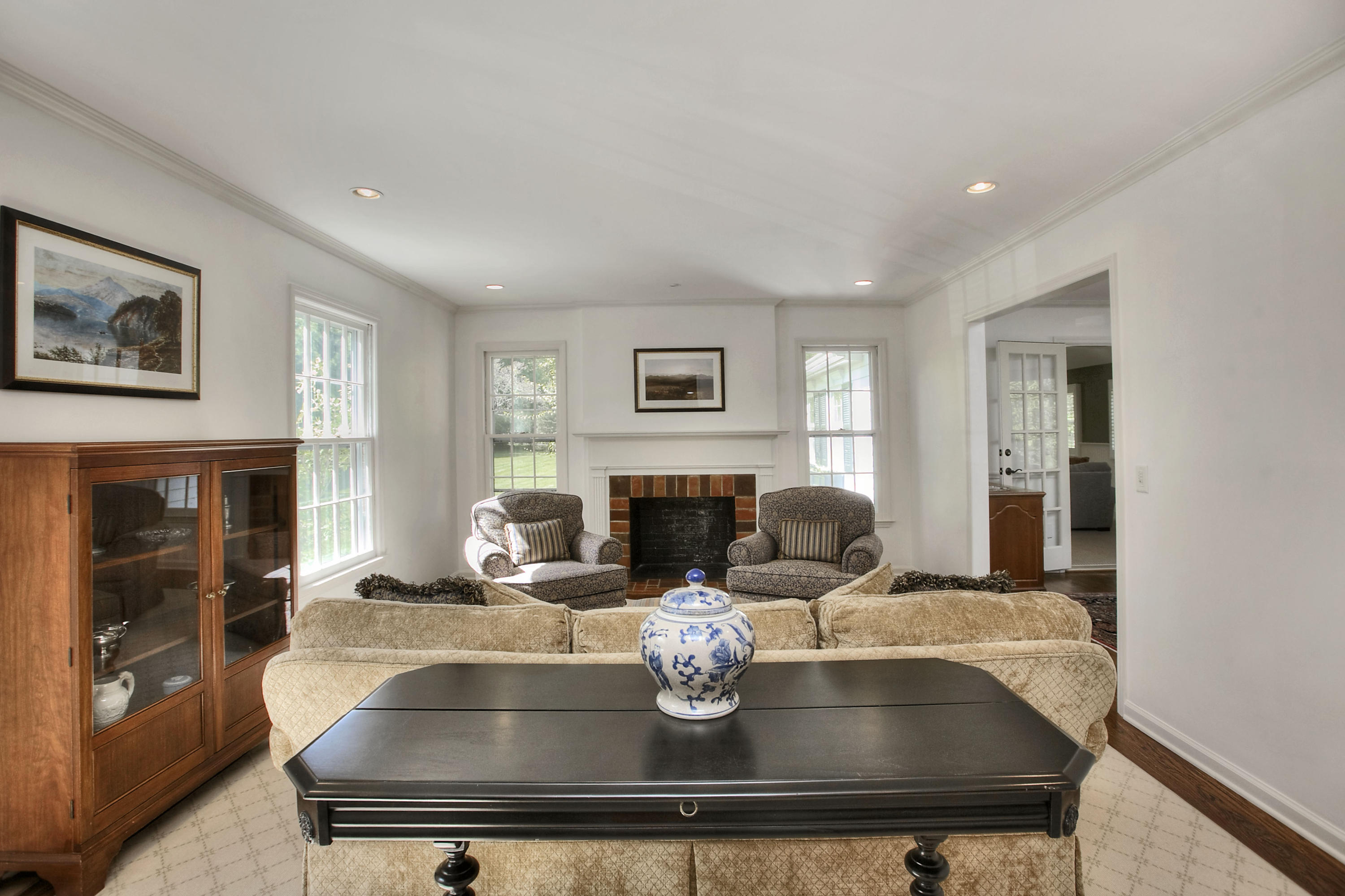 195 Ponus Ridge Road New Canaan, CT 06840 - Photo 9 of 28 a living room with fireplace furniture and a window