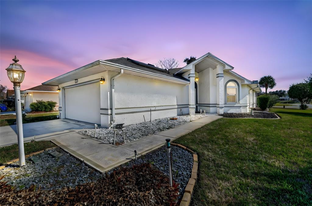 5500 Laver Street Leesburg, FL 34748 - Photo 1 of 35 a front view of a house with garden