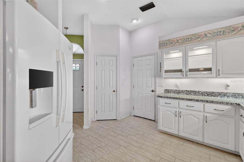 5500 Laver Street Leesburg, FL 34748 - Photo 12 of 35 a bathroom with a granite countertop sink and a mirror
