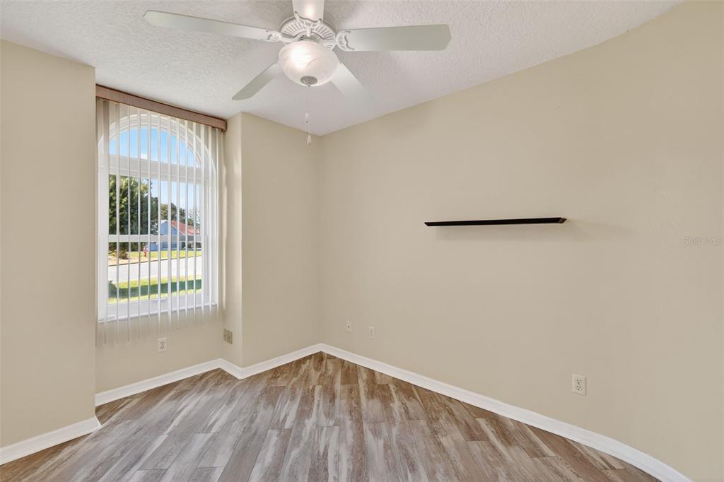 5500 Laver Street Leesburg, FL 34748 - Photo 18 of 35 wooden floor in an empty room with a window