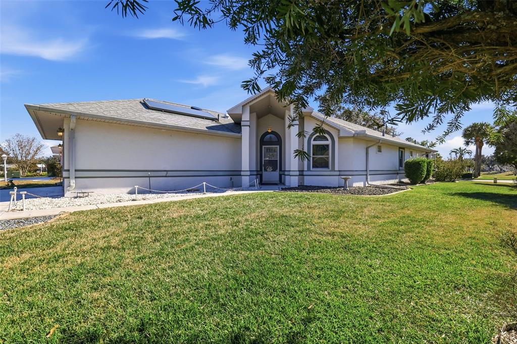 5500 Laver Street Leesburg, FL 34748 - Photo 3 of 35 a front view of a house with garden