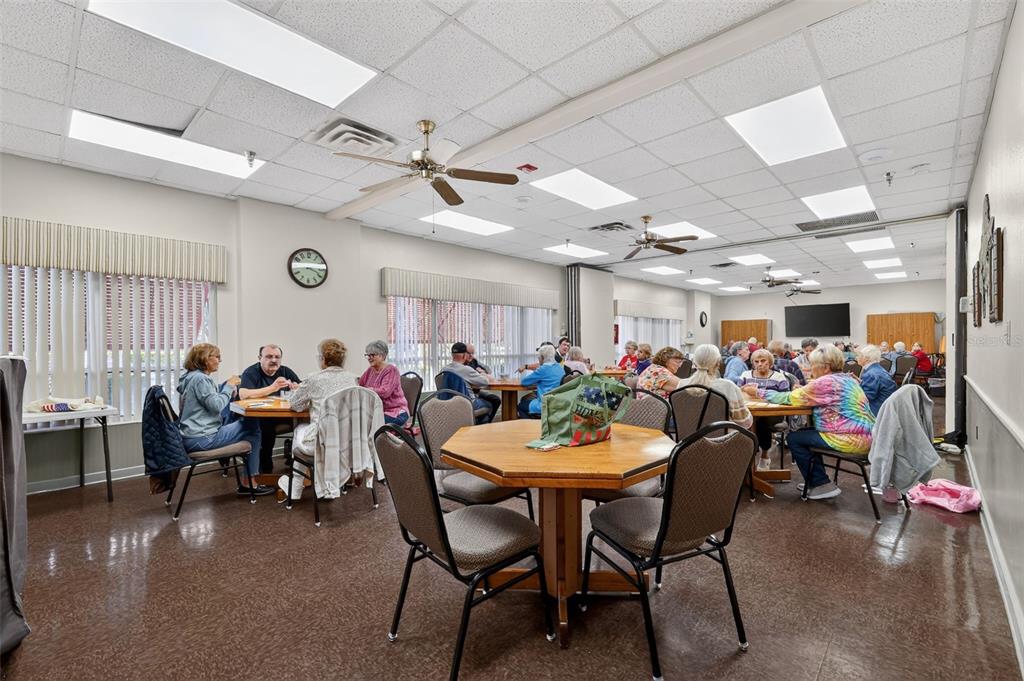 5500 Laver Street Leesburg, FL 34748 - Photo 31 of 35 a group of people sitting in a living room