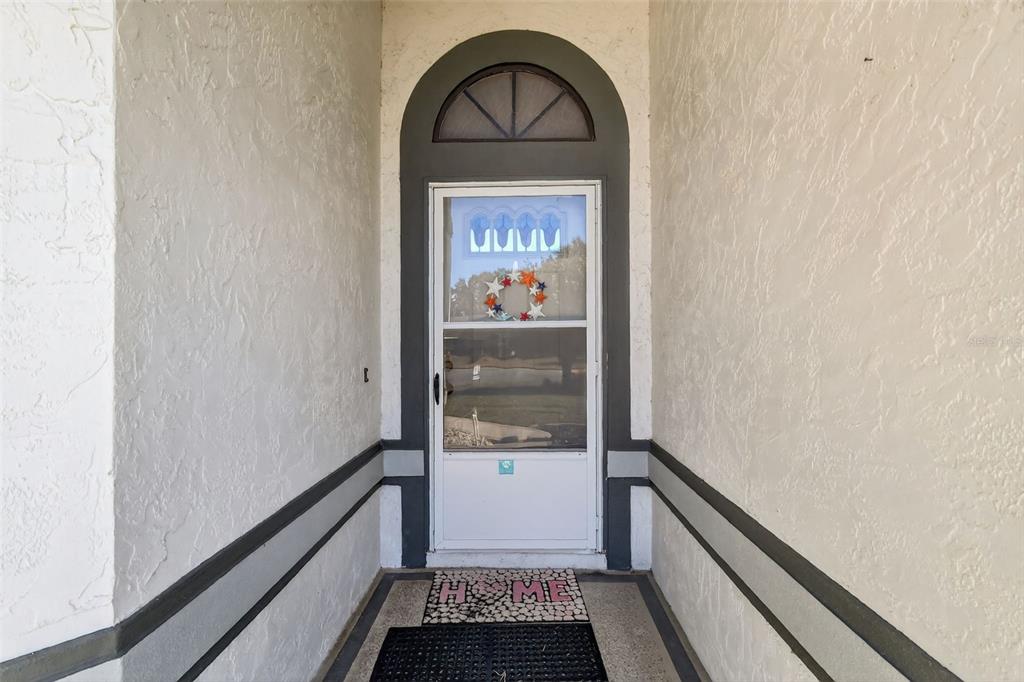5500 Laver Street Leesburg, FL 34748 - Photo 4 of 35 a glass door with a glass door